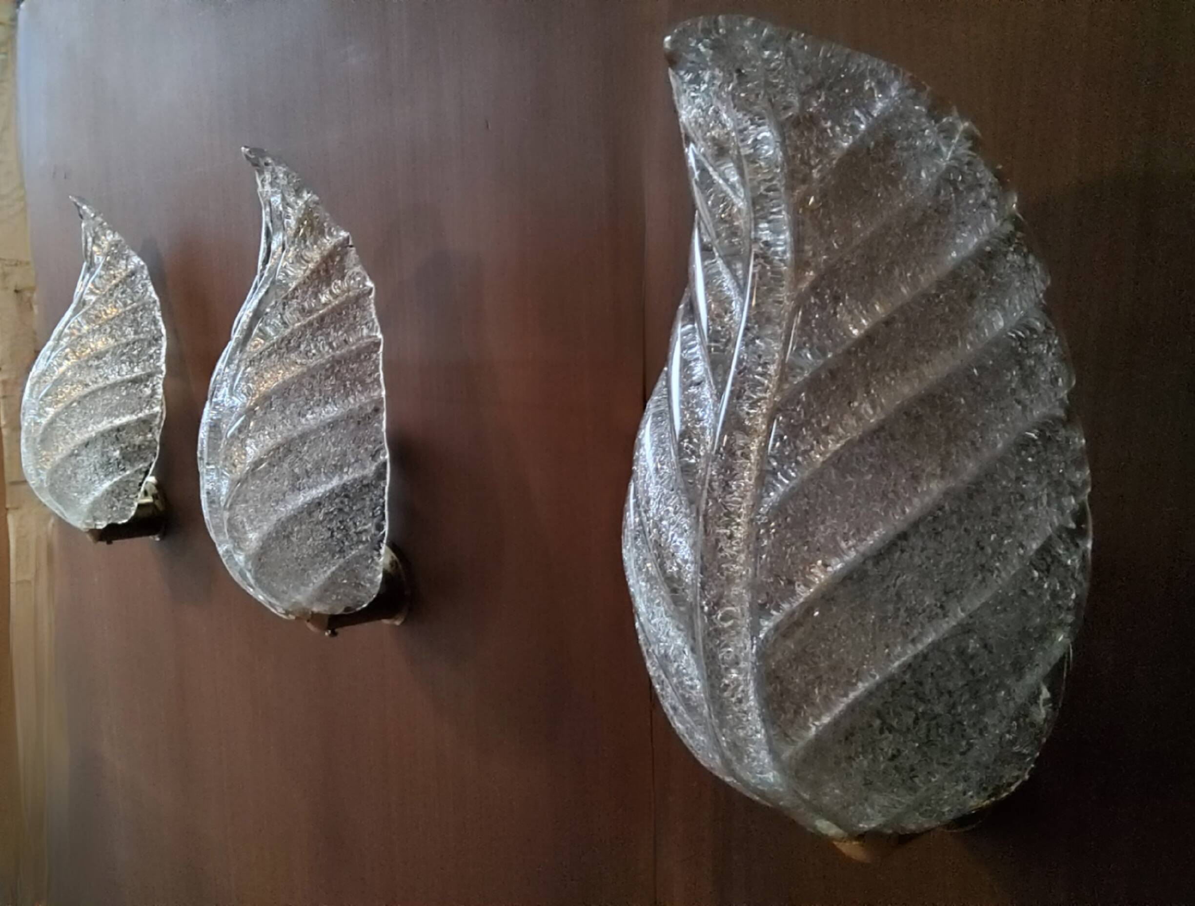 Murano, leaf sconces in worked transparent glass, 1940s
