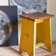 Art-populaire workshop stool in patinated wood