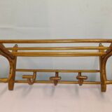 Coat rack with curved wooden hat holder