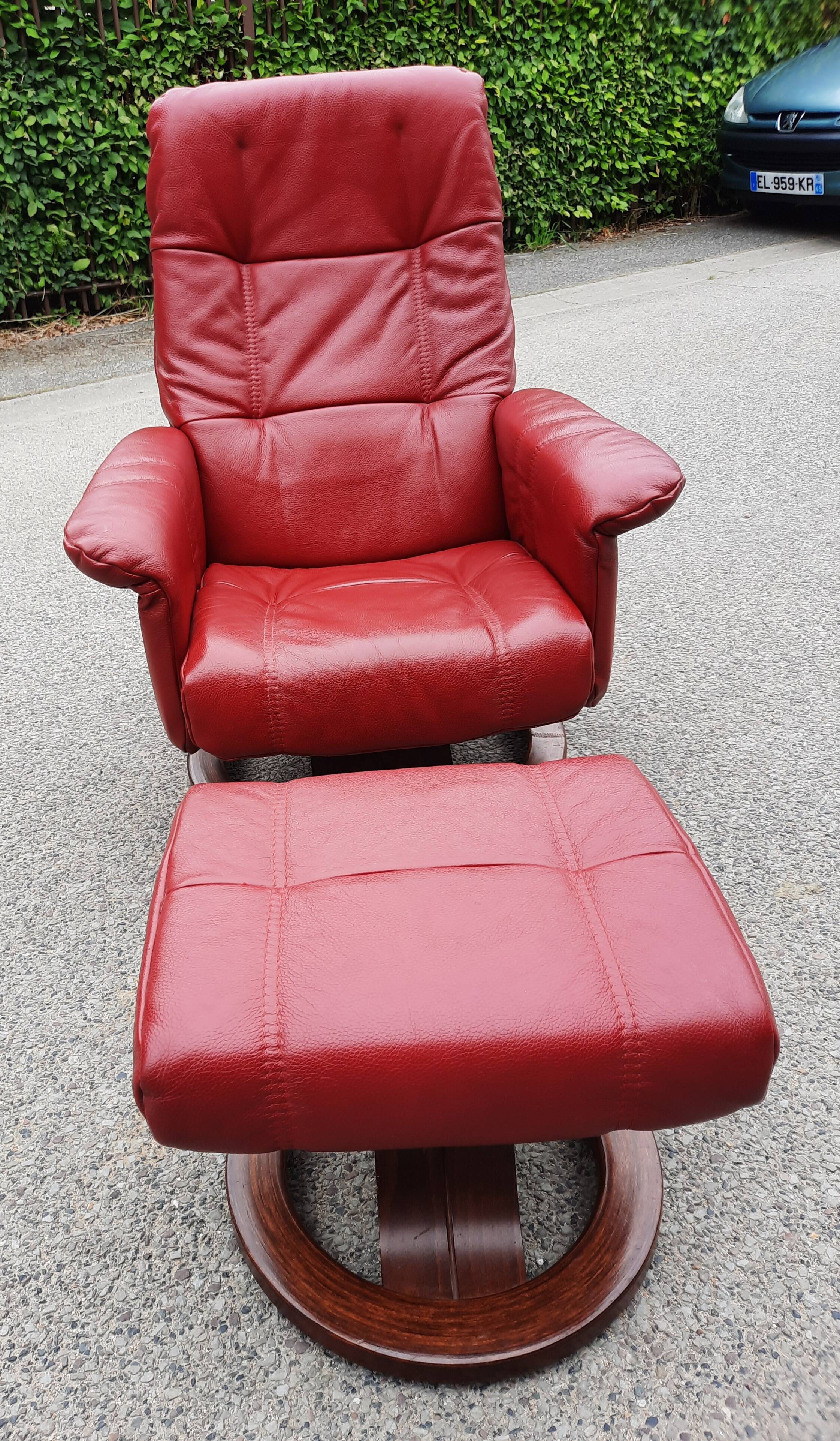 Red leather relax armchair and pouf