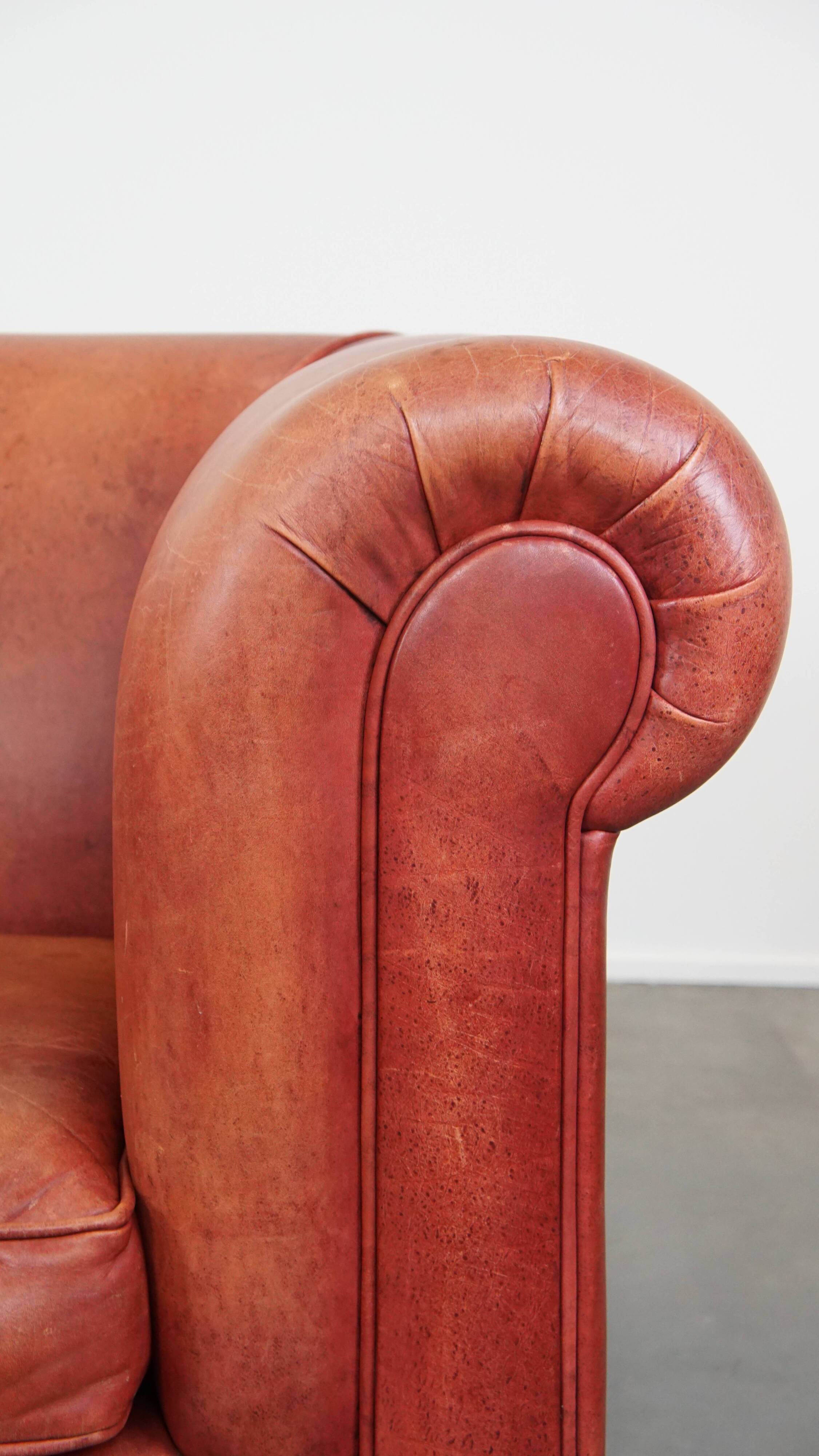 English Chesterfield club chair in light red cowhide leather