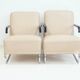 Pair of beige leather and tubular steel armchairs.