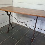Bistro table with cast iron base and oak top