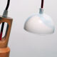 Hanging Ozcanay Dinlatma, contemporary in white metal and wood. Very good condition.