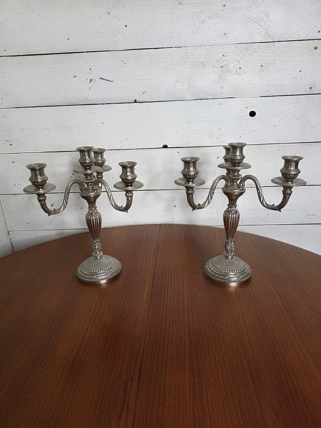 Pair of Louis XVI style candlesticks in silver-plated bronze