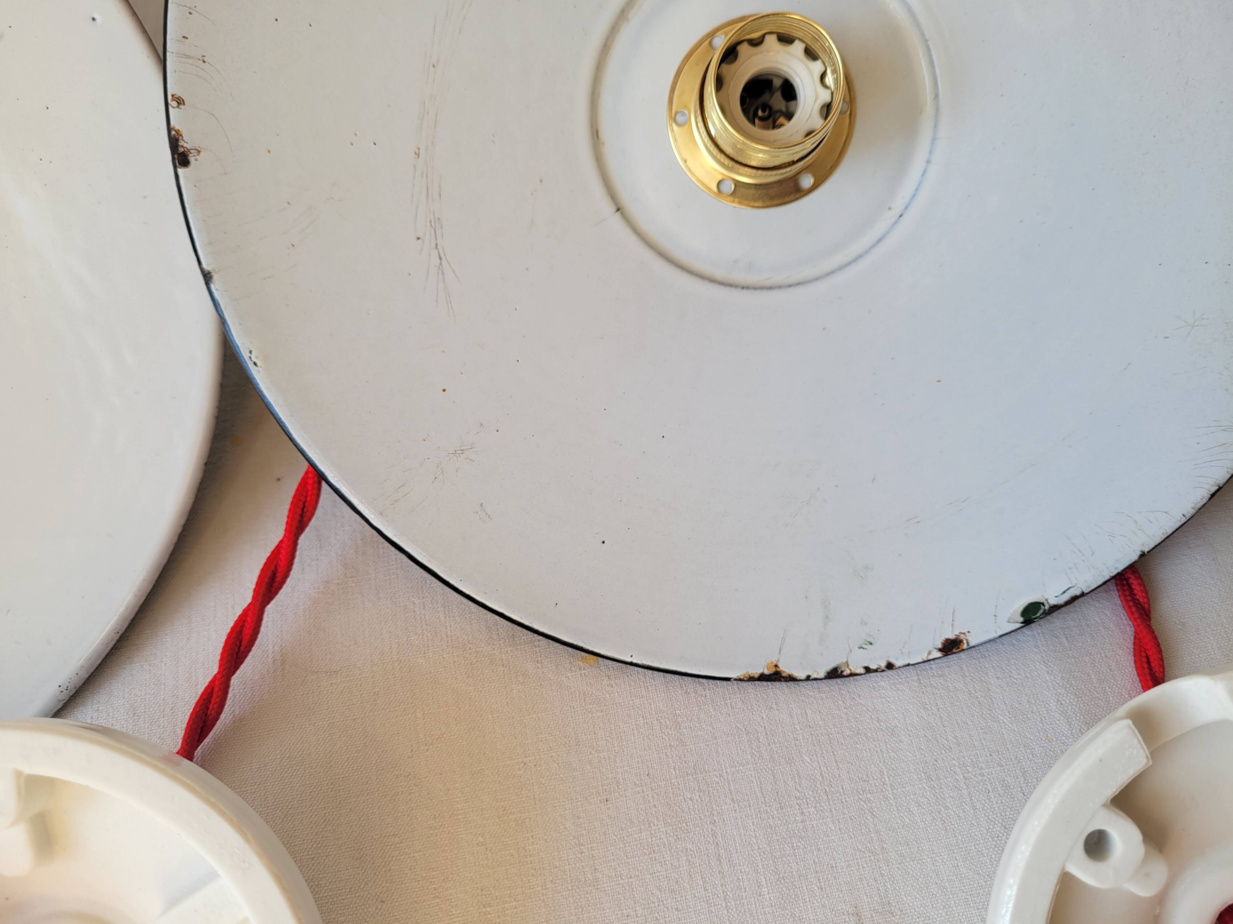 Trio of enameled sheet metal pendant lights