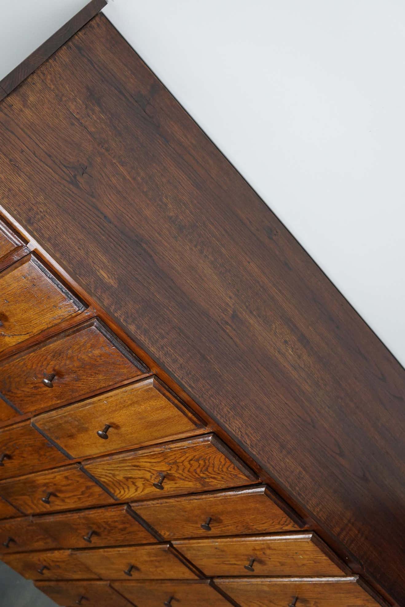 Antique apothecary furniture in oak France early twentieth century