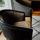 Pair of Art Deco barrel chairs in black and bronze