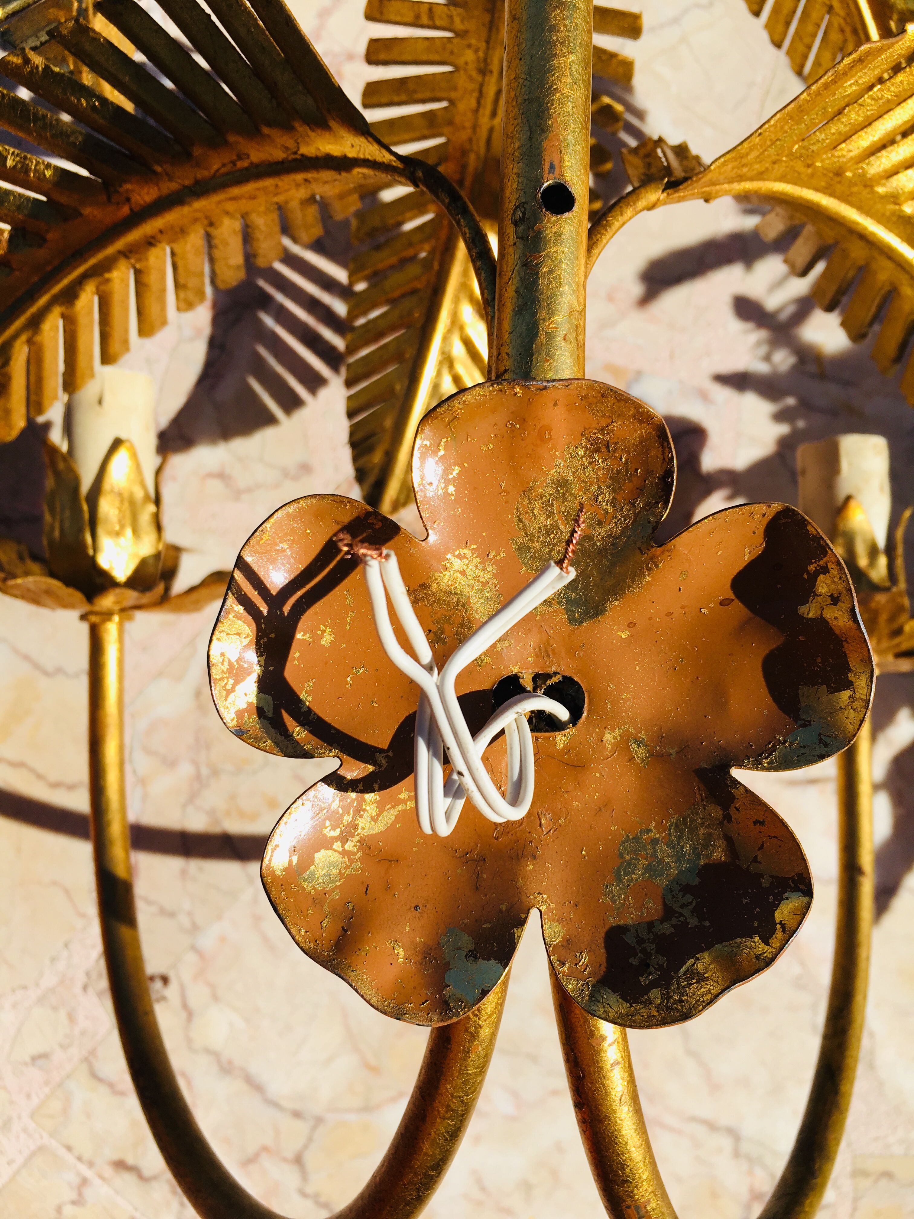 Golden palm leaf sconce