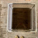 Square brass coffee table and smoked glasses