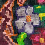 Bohemian floral design, handwoven wool rug, black background with colorful flowers