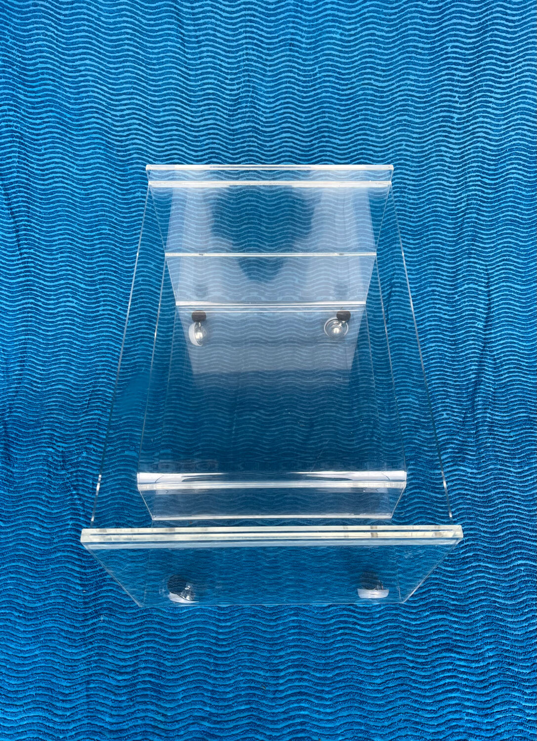 Translucent plexiglass storage drawer/cabinet on wheels.