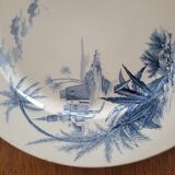 Flat in iron earth "views of the Orient" faience of Gien