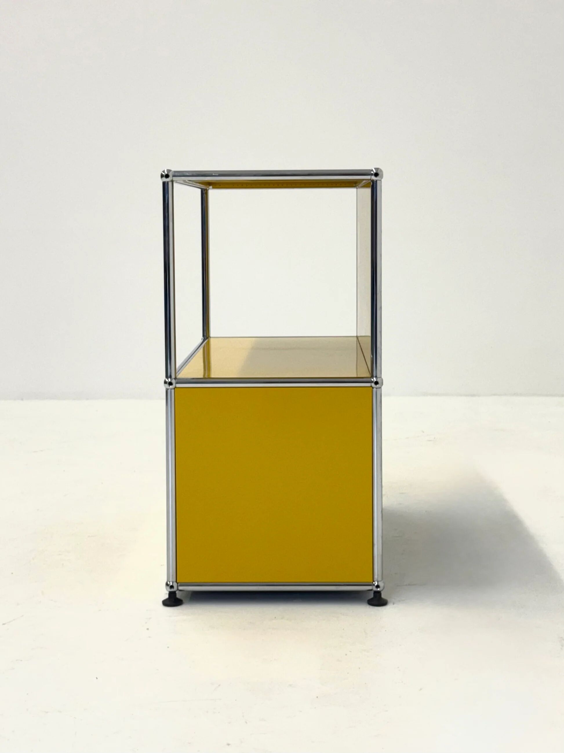 USM Haller cabinet in yellow