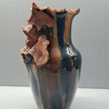 Terracotta vase with a child's head