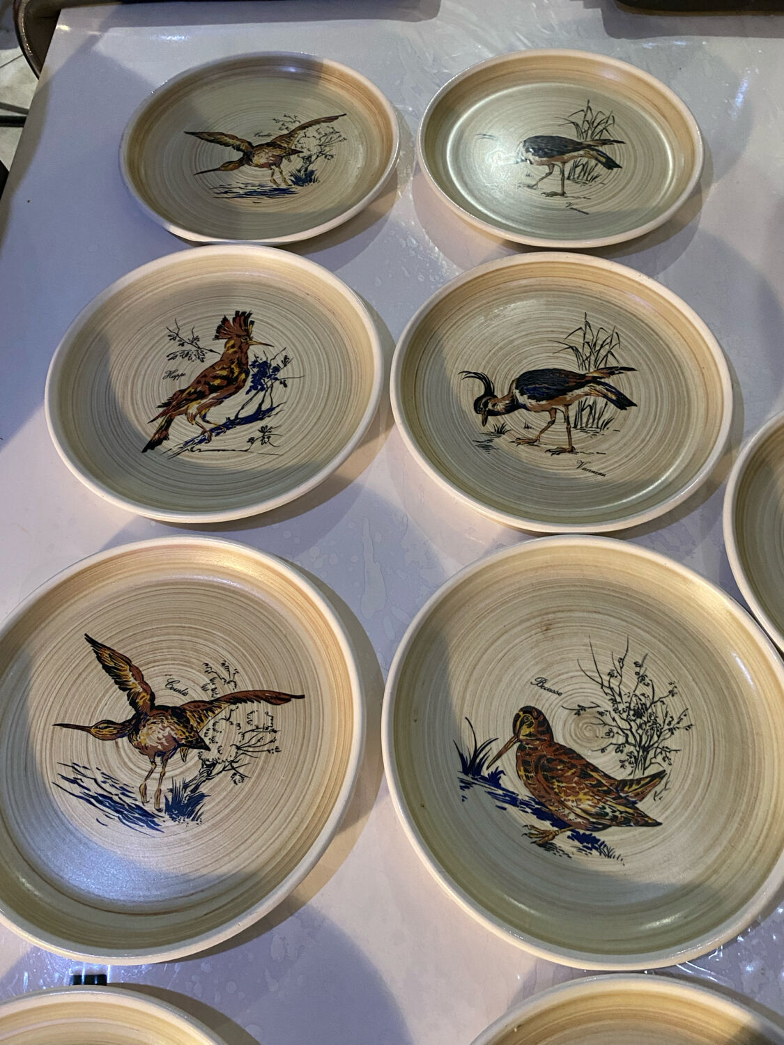 Many vintage flat plates from Sarreguemines.