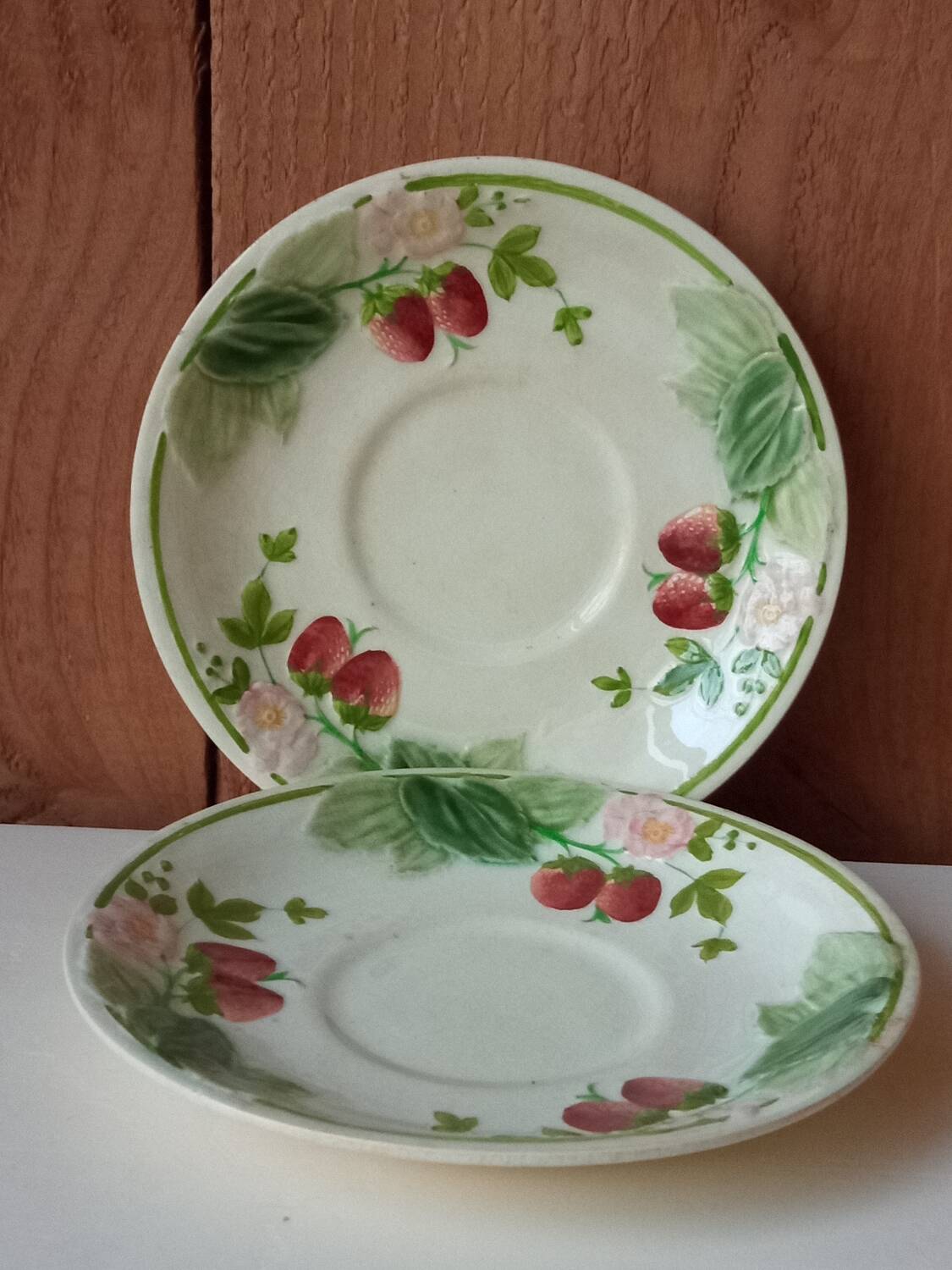 Two earthenware plates, H B, Choisy le roi