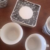 Black and white cups with plates