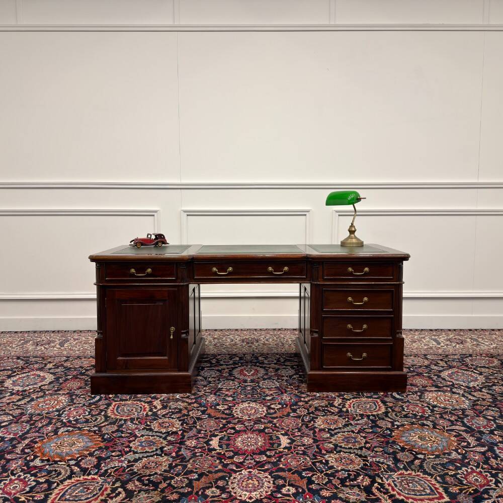 Classic English desk with green leather inlay.