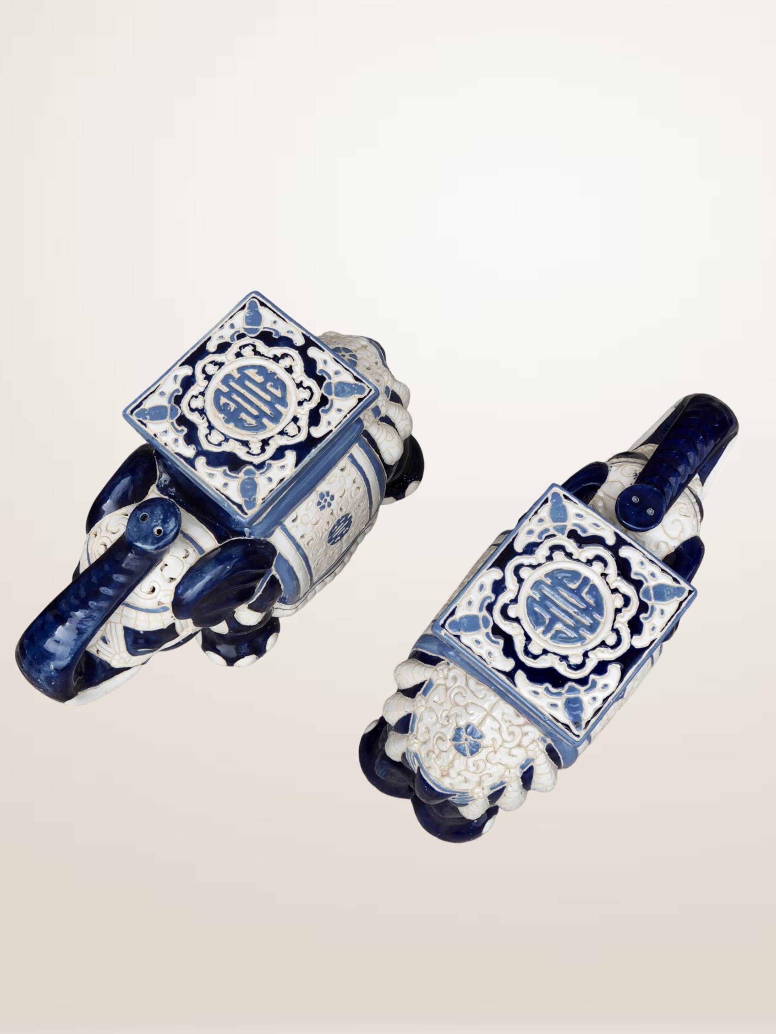 Pair of elephant ceramic side tables