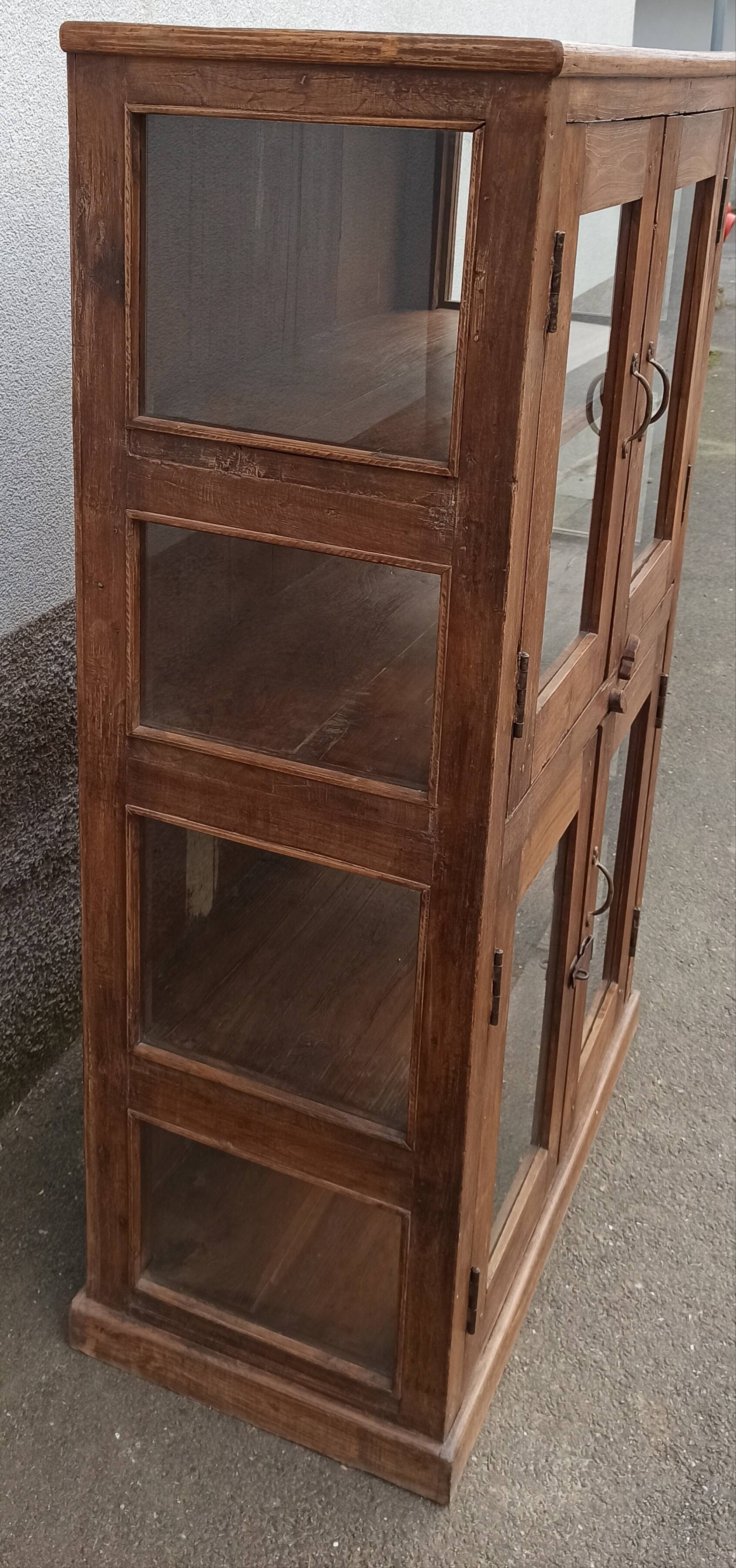 Old wooden display cabinet with three glazed sides