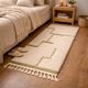 Beige Berber rug with a structured green abstract pattern.