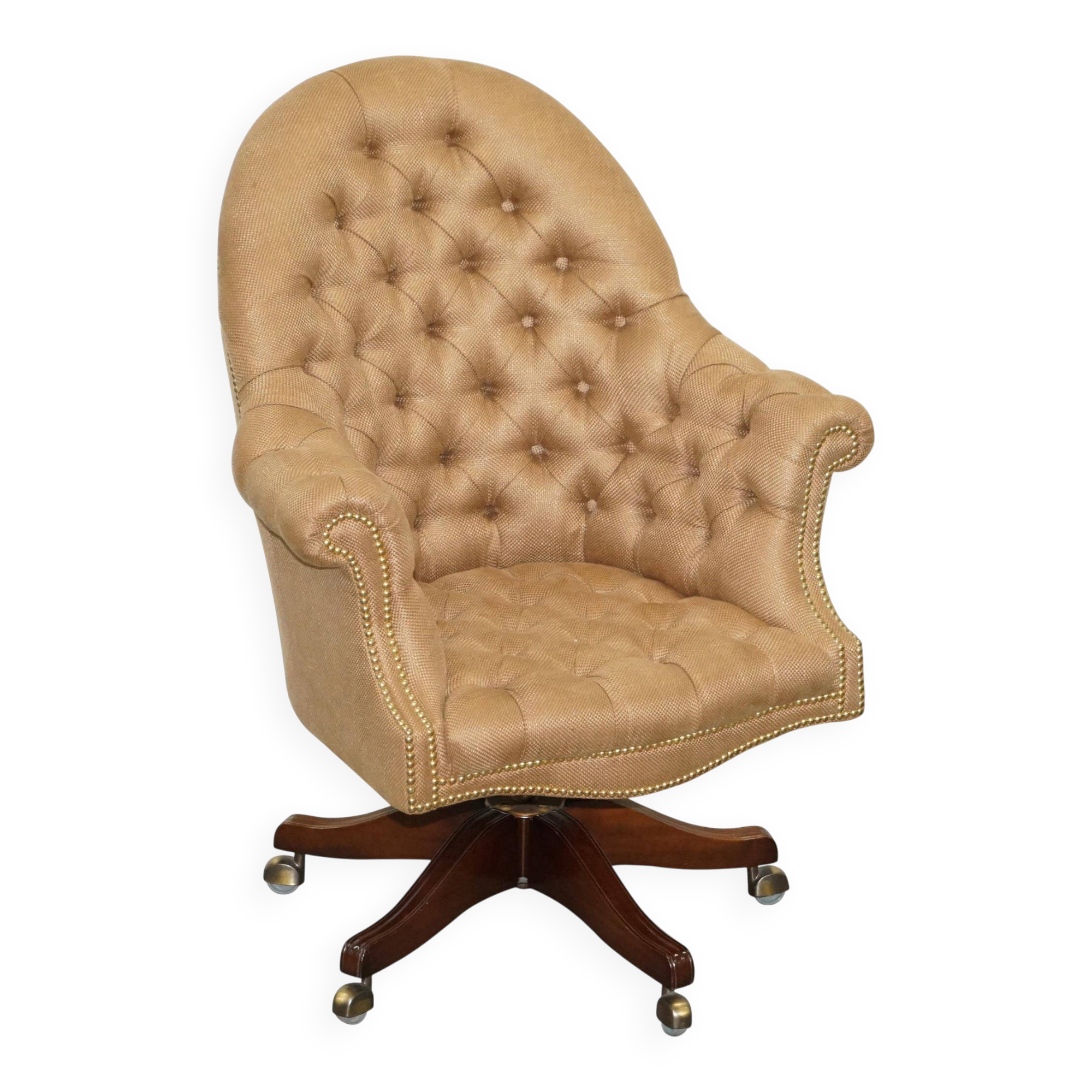 Chesterfield armchair in hardwood, leather, and woven linen.