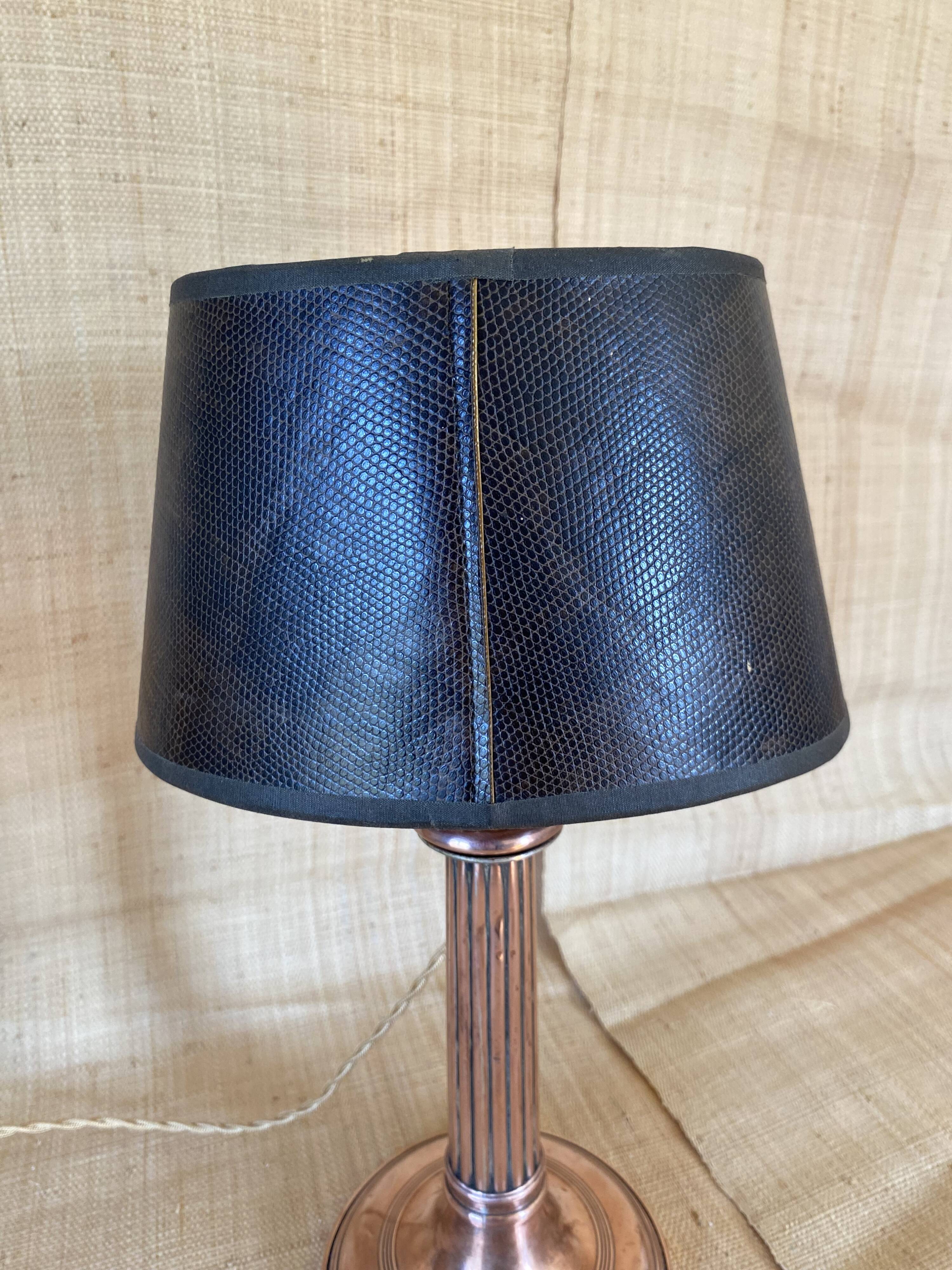 Copper lamp, fabric cable, sewn lampshade and leather.