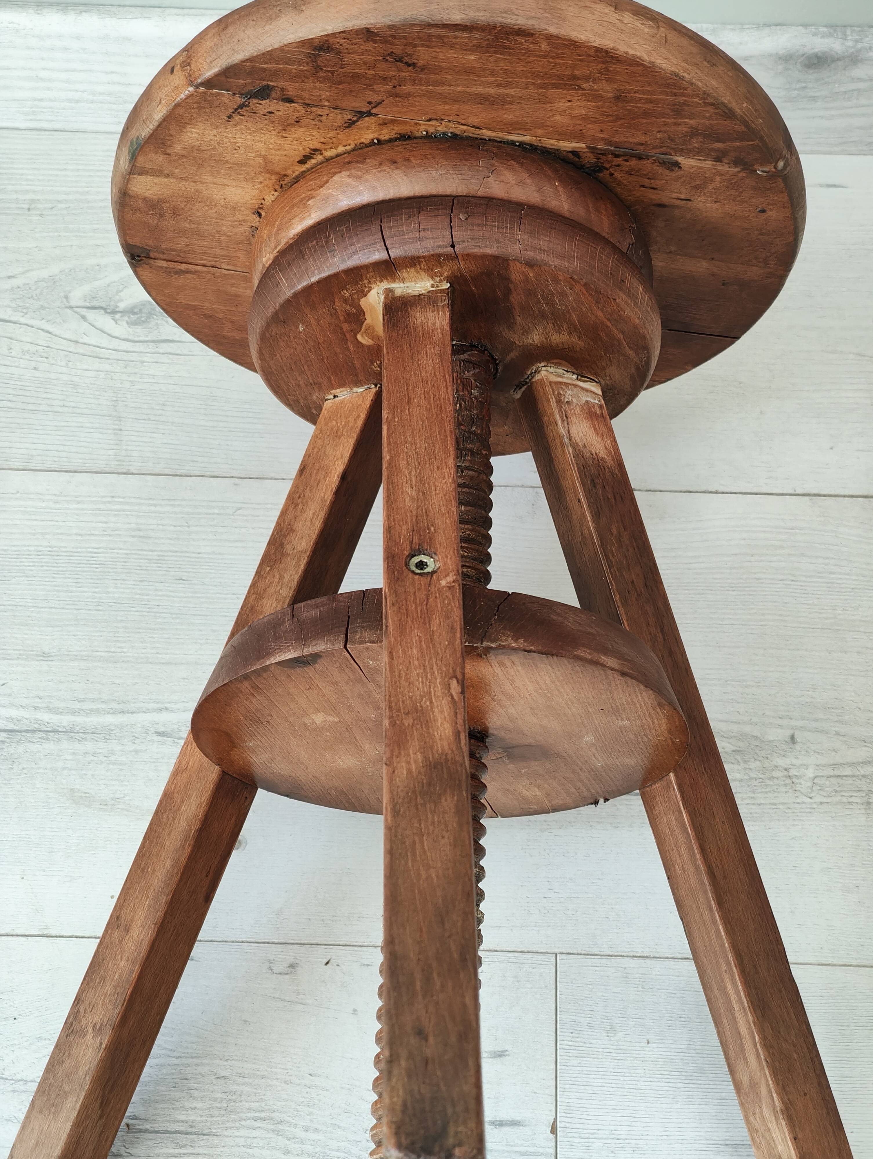 Adjustable vintage workshop stool made of solid wood
