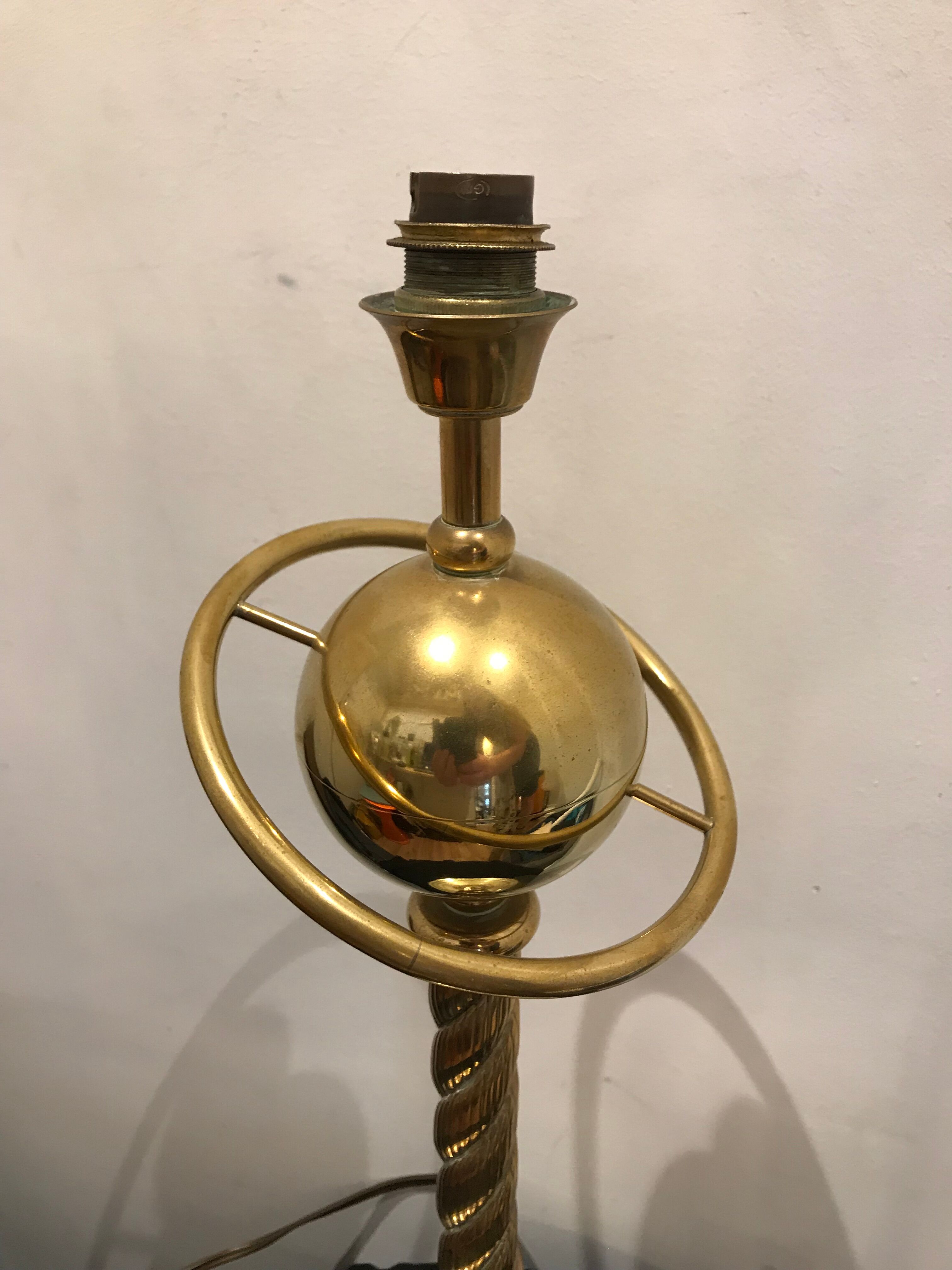 Brass lamp with removable ring around a globe