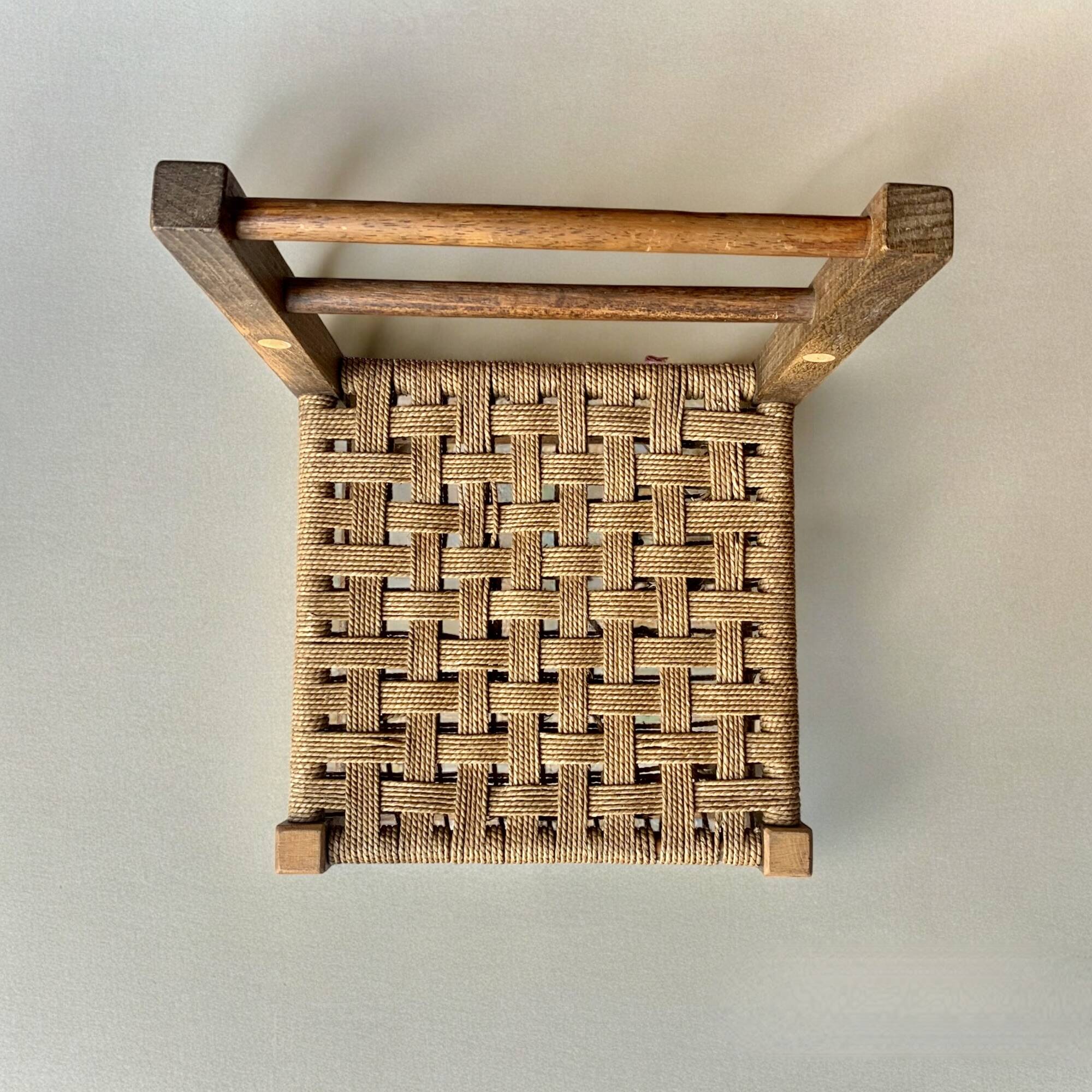 Vintage children's chair made of rope and wood