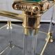 Pair of tables in brass, acrylic and glass