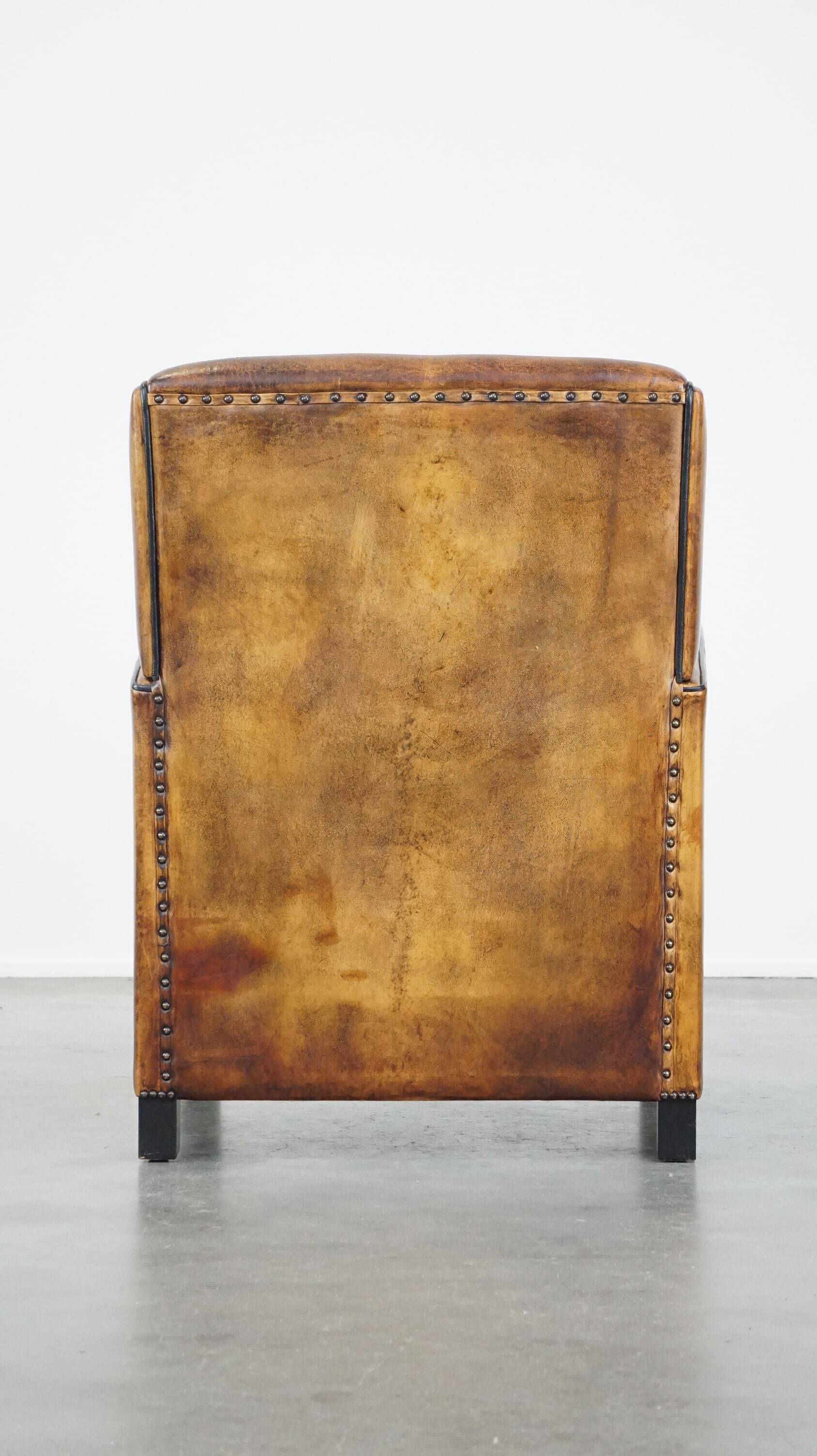 Art Deco sheep leather armchair with a lot of character