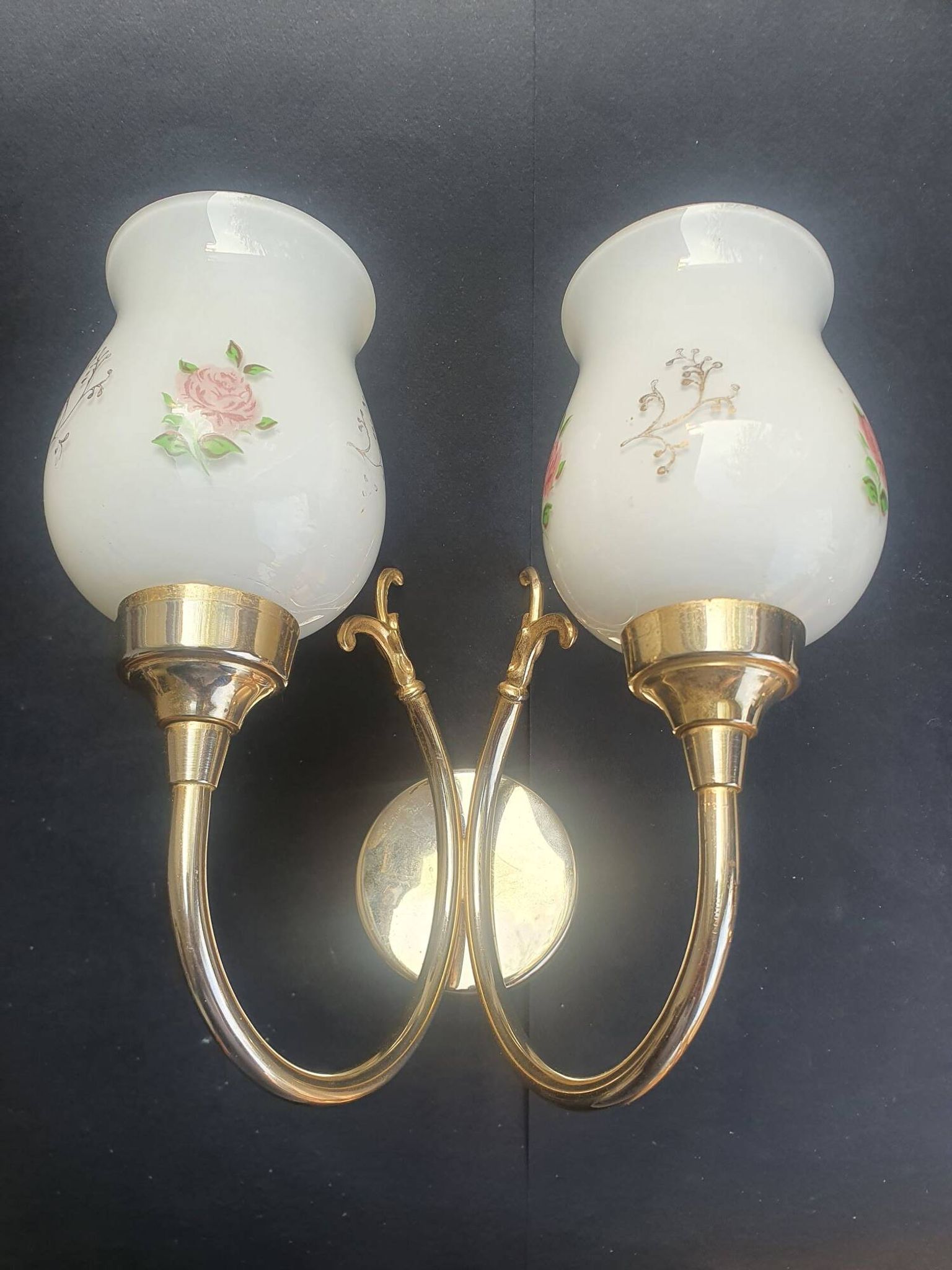 Pair of vintage wall sconces in gilded brass and pink opaline glass.