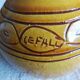 Round ochre glazed jug with handle
