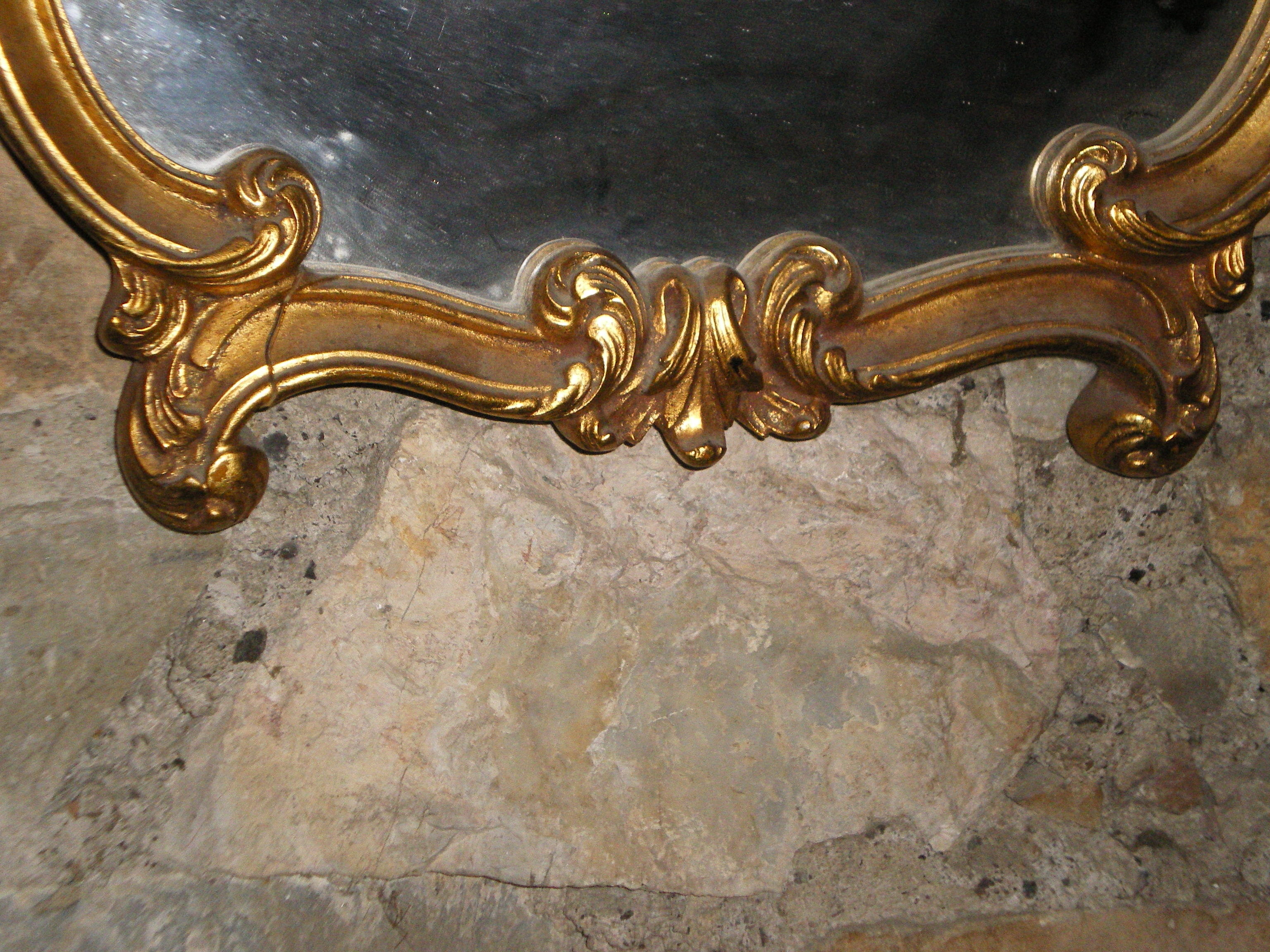 Large gilded mirror Louis XV style with shell.