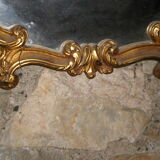 Large gilded mirror Louis XV style with shell.