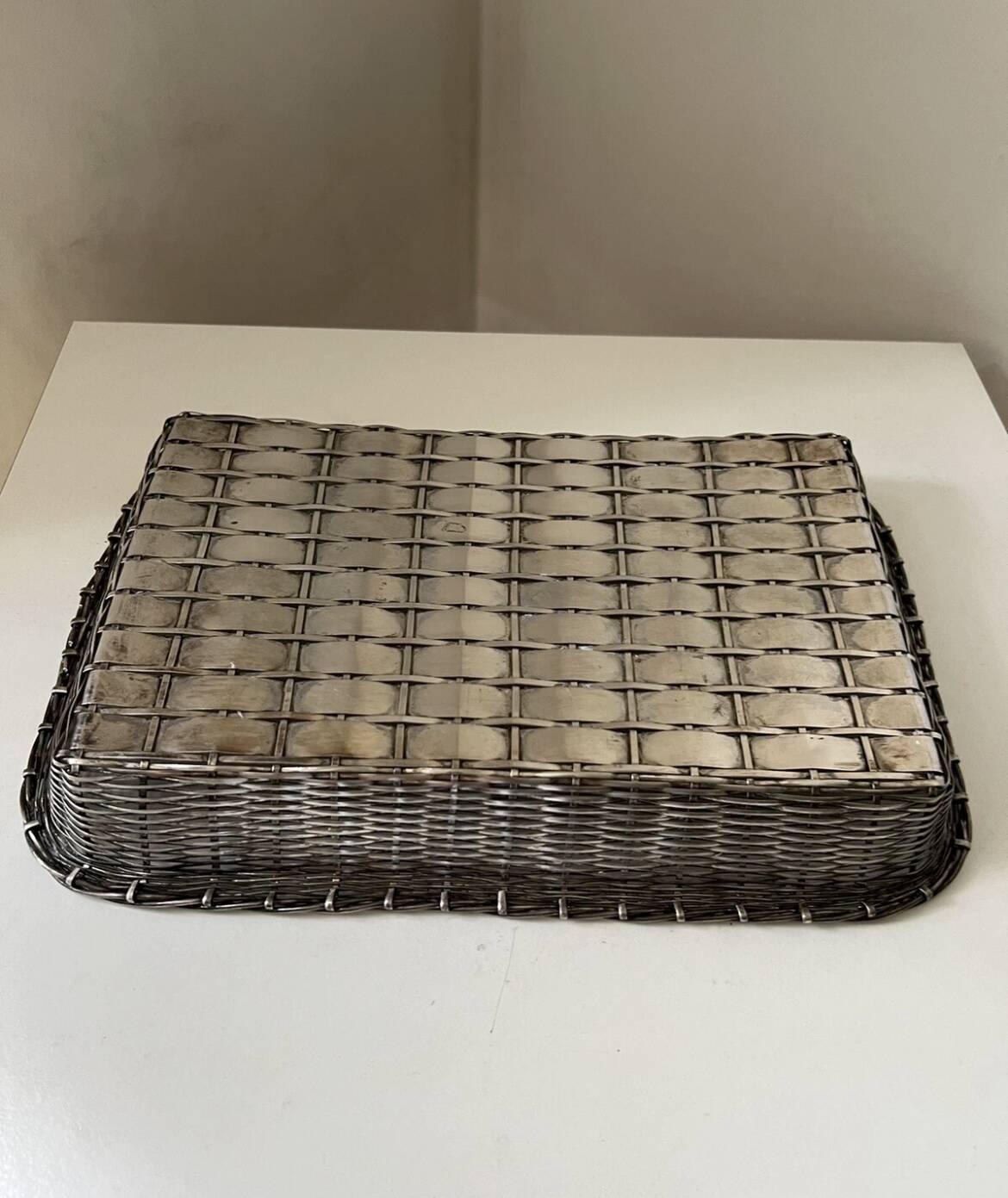 Woven silver metal bread basket