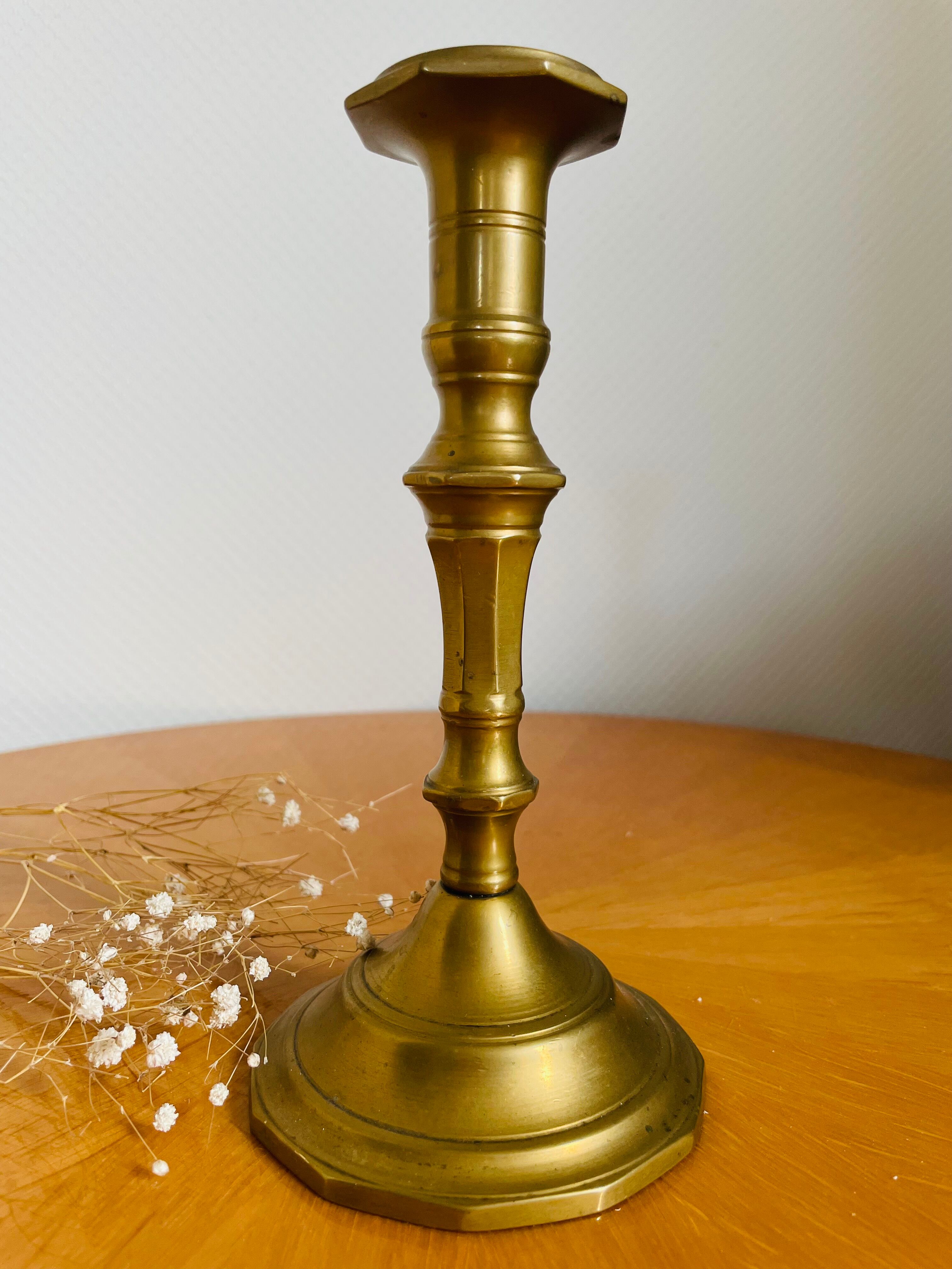 Old brass torch candle holder