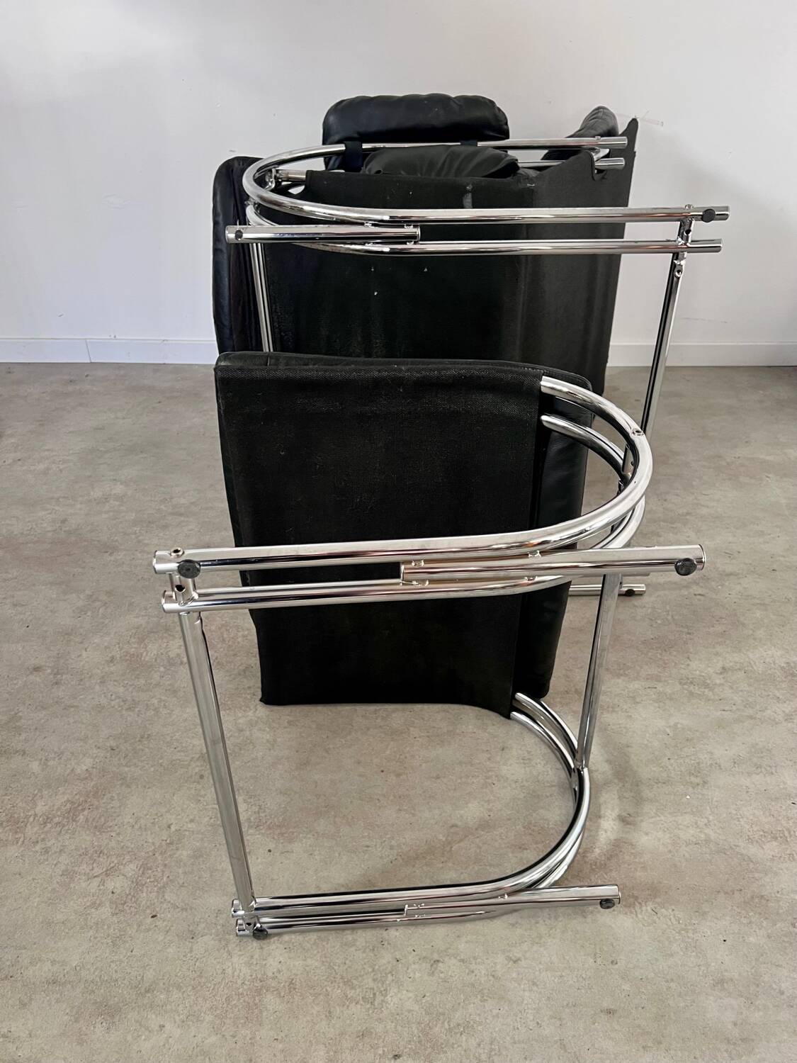Old armchair and ottoman black leather tubular chrome bauhaus design from the 70s