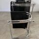 Old armchair and ottoman black leather tubular chrome bauhaus design from the 70s