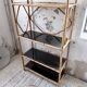 Rattan bookshelf and black glasses