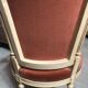 Patinated armchair in Louis XVI style