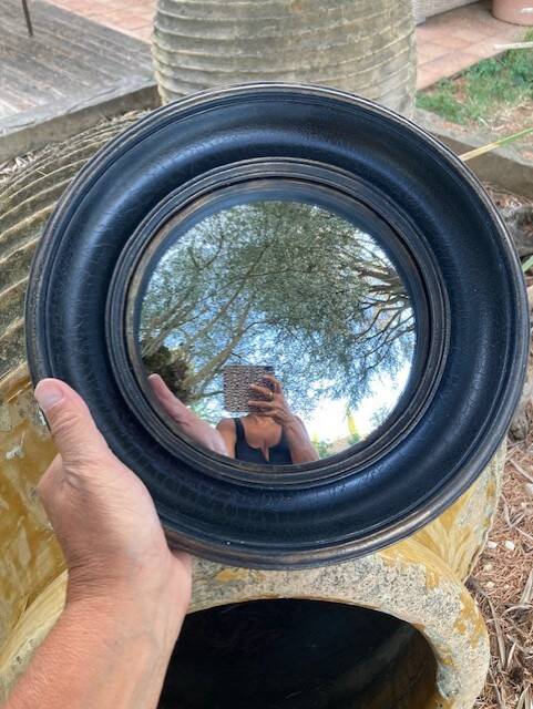 Convex mirror, also known as a witch's mirror.
