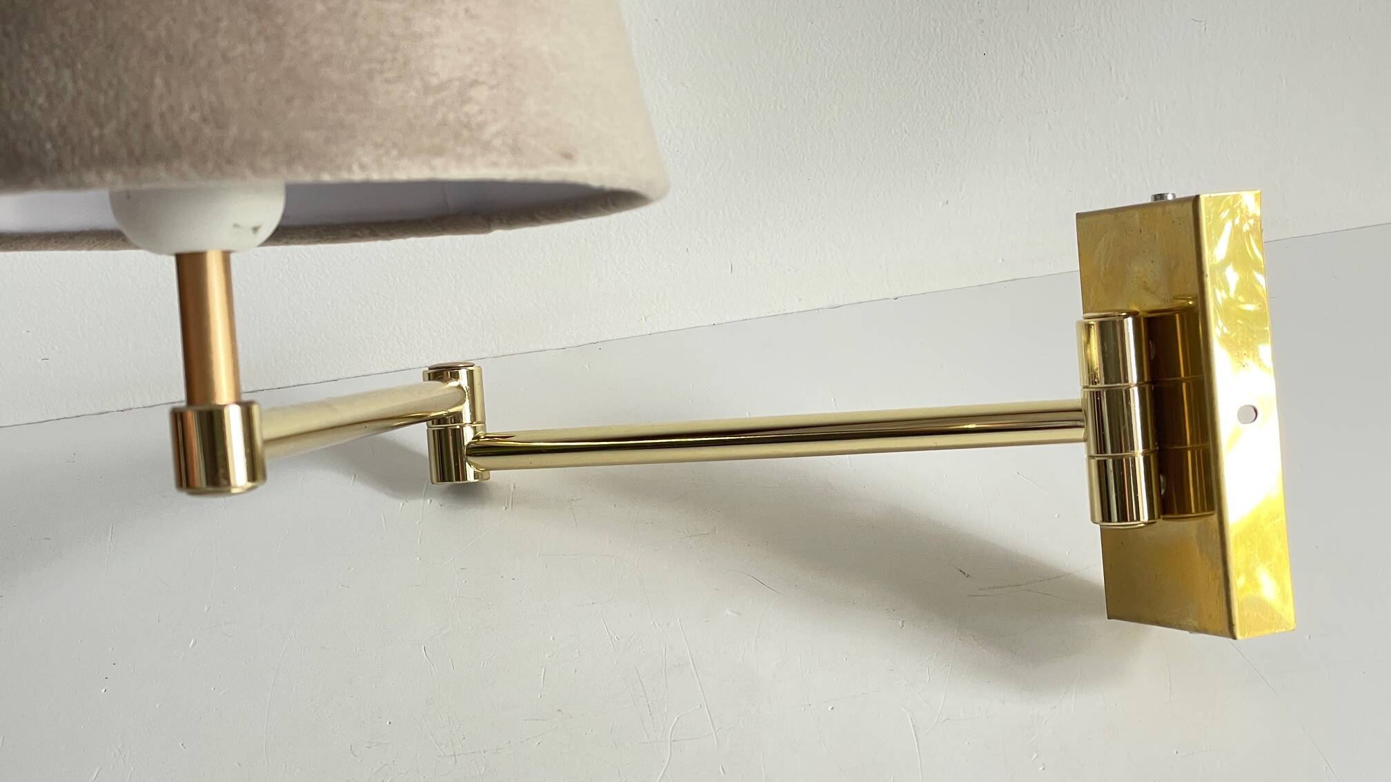 articulated brass and velvet wall light