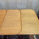 Oak dining table with integrated extensions