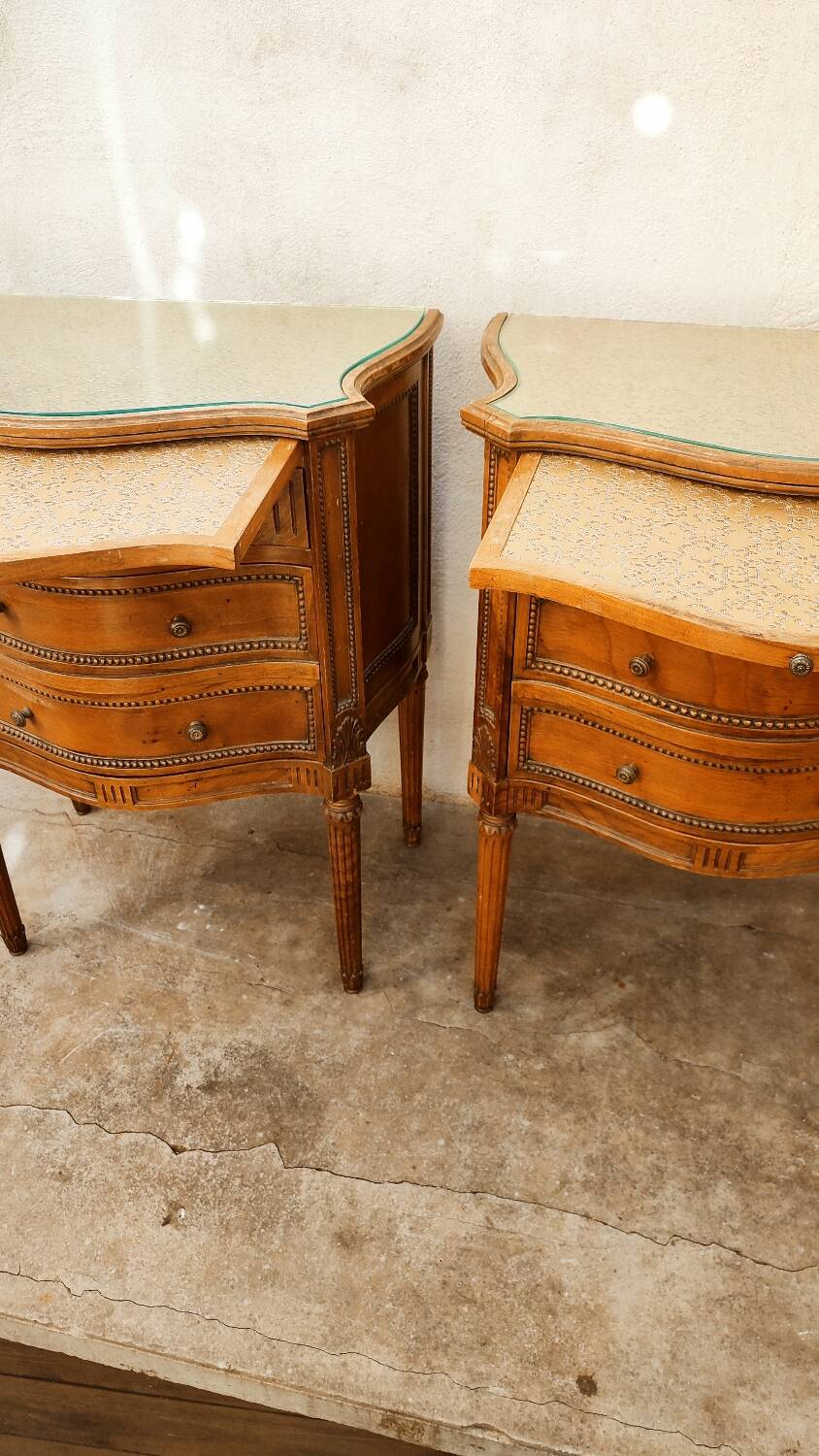 Pair of walnut crossbow chests of drawers