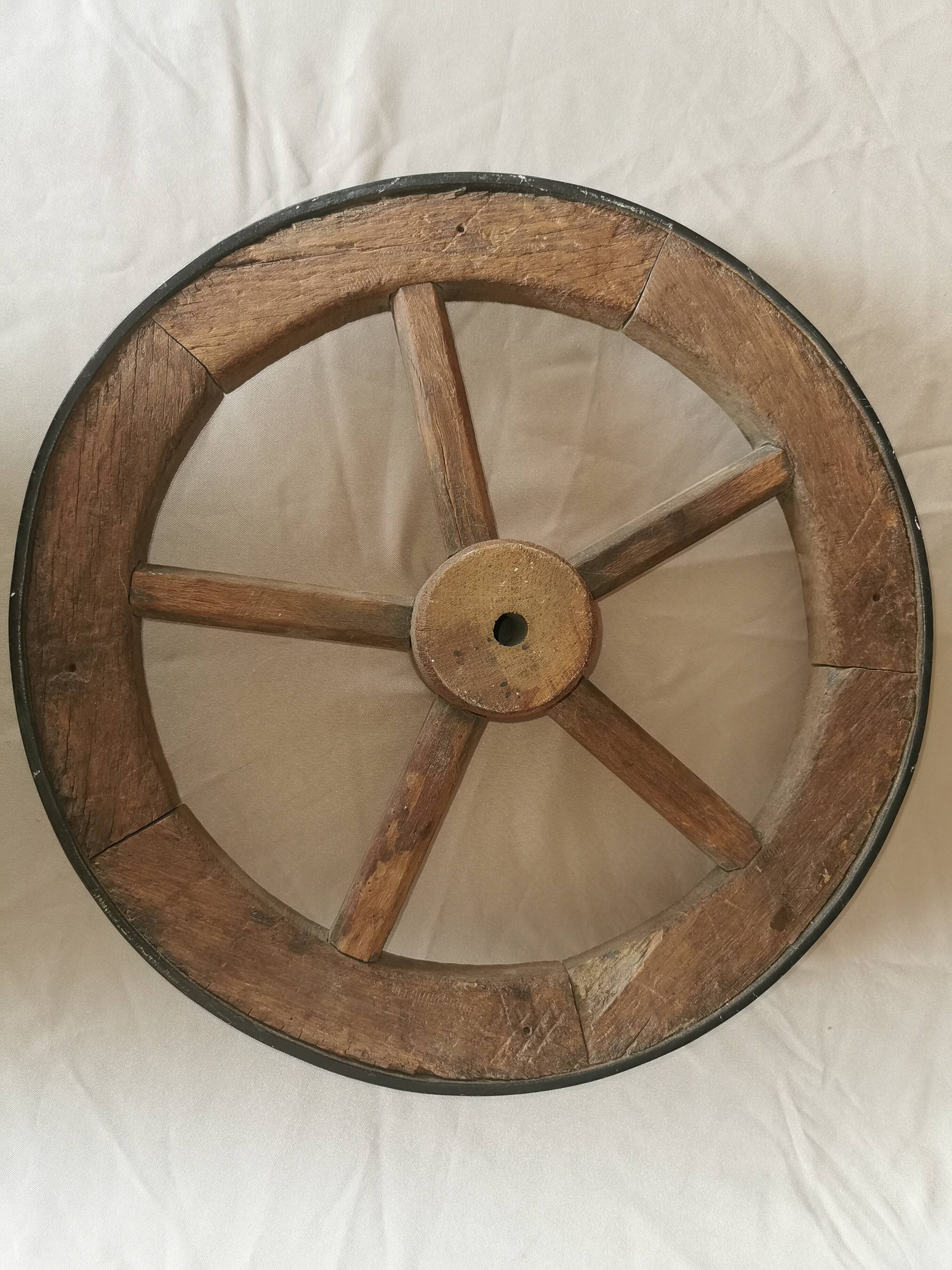 Old wheelbarrow or plow wheel