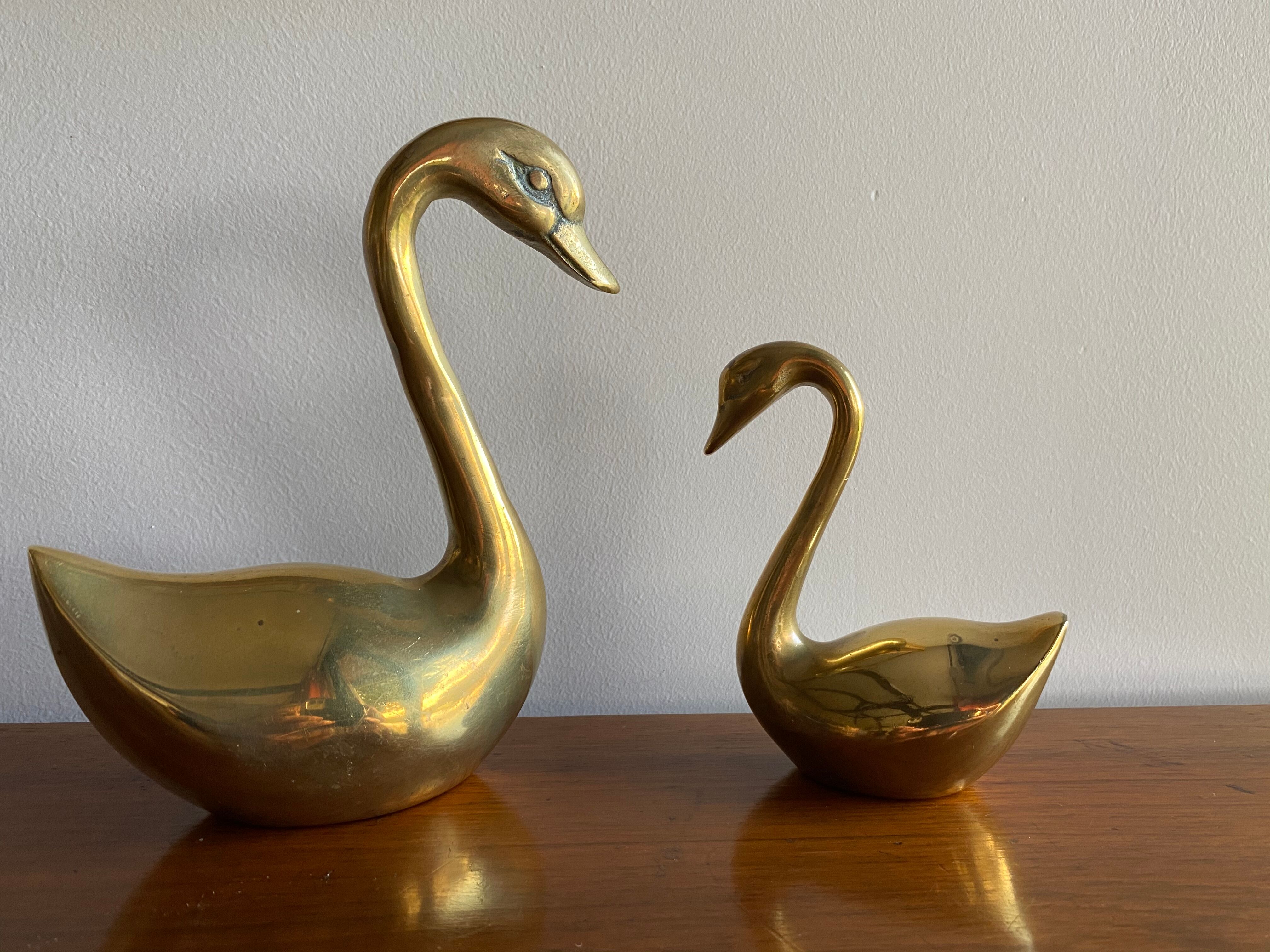 Duo of ancient brass swans