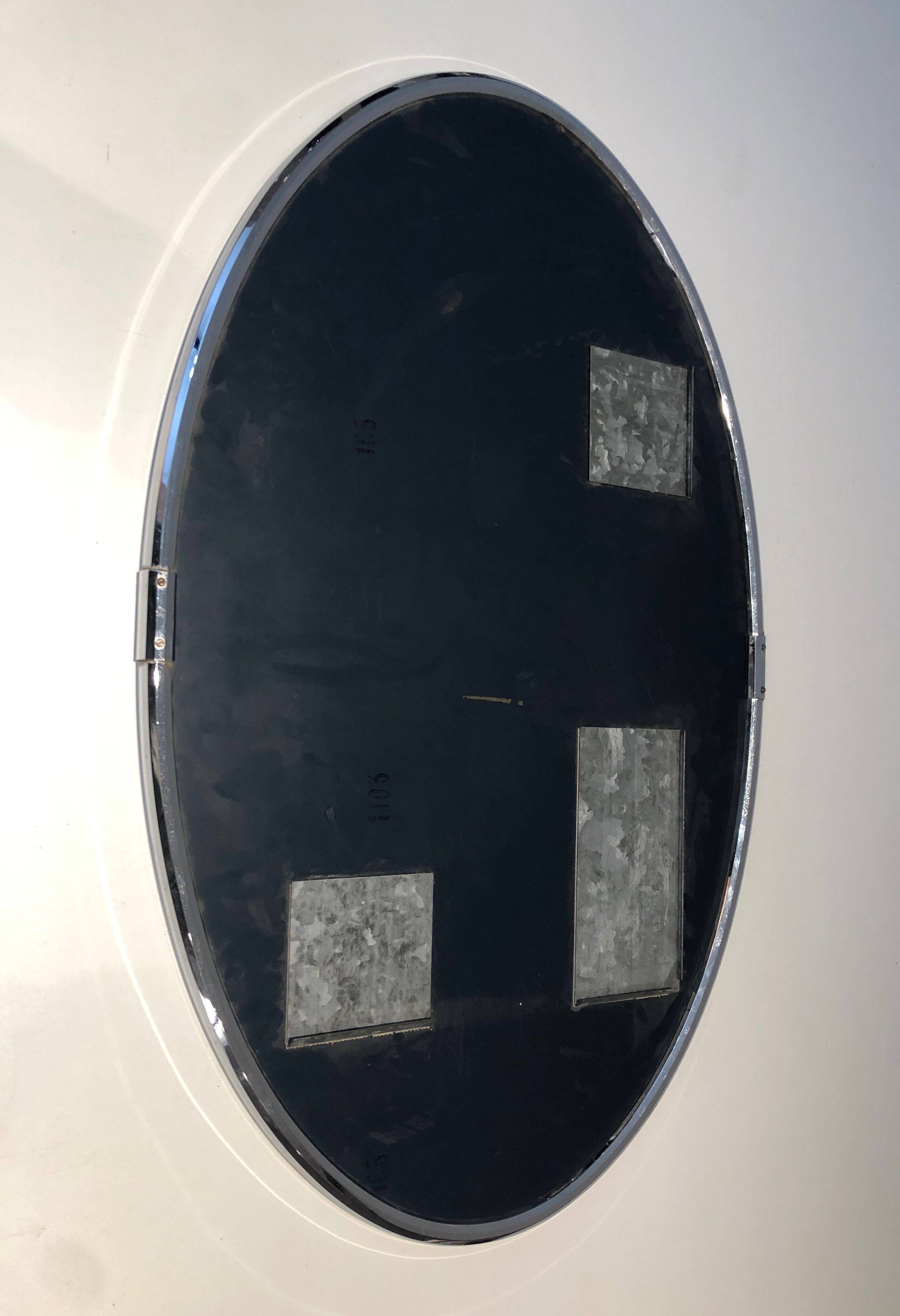 Oval chrome mirror in Art Deco style. Circa 1970.